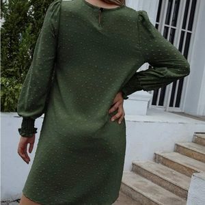 It’s a green short dress long sleeve nice material